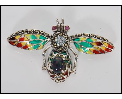 A silver Plique a jour brooch / pendant necklace in the form of dragonfly having central opal cabochon and marcasite detailin