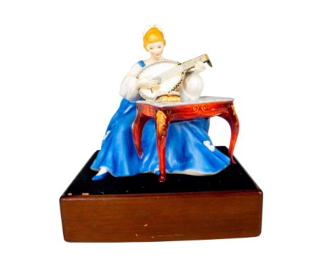 Limited edition in matte and glossy finish modeled as a woman seated at a table wearing a sky blue dress playing the lute. Th