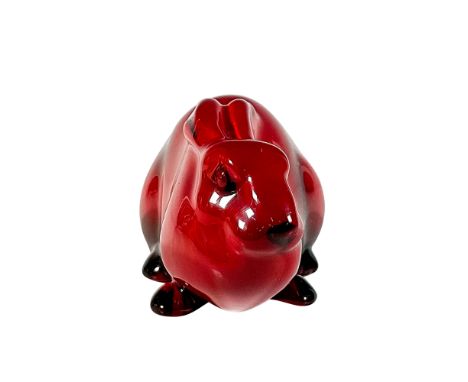 Style one; early figure of a hare with both ears lower to its back in beautiful rich red glaze. Model no. 119. Signed Noke to