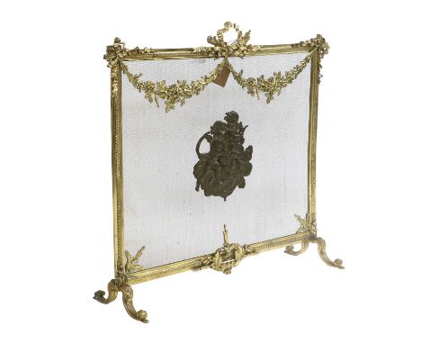 A French Gilt Brass Single Mesh Firescreen, late 19th century, the rectangular frame with guilloche border with ribbon form h
