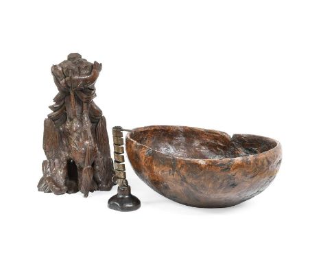 A Carved Oak Wall Bracket, 19th century, as a crane on a rocky outcrop37cm highA Dug-Out Burr Wood Bowl42cm wideA French Iron
