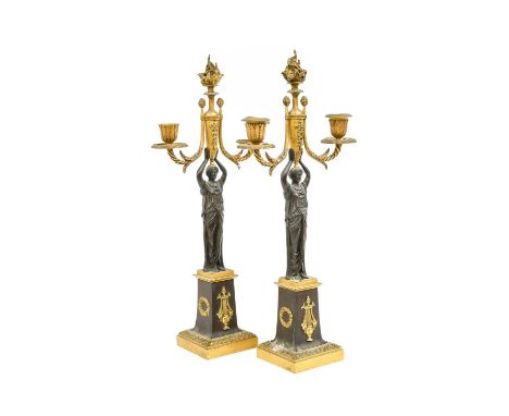 A Pair of French Empire-Style Gilt and Patinated Bronze Candelabra, with flamiform finials and twin sconces on scroll branche