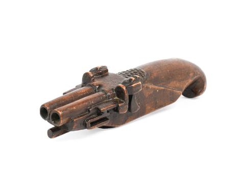 A Treen Pistol Snuff Box, early 19th century, in the form of a double-barrelled flintlock pistol with hinged compartment to t