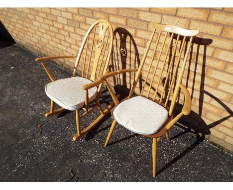 An Ercol rocking chair with carved swan motif to backrest and an Ercol stickback armchair. [2]