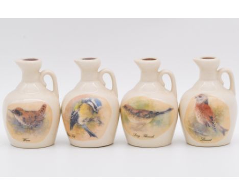 Twenty four assorted Rutherford's white ceramic decanters, blended Scotch whisky, including herb series, and British garden b