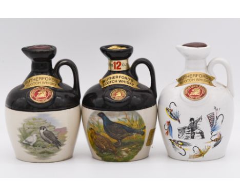 Four Rutherford's 12 year old ceramic decanters, each 20cl, 40%, by Montrose Pottery; a Castle Collection Lochside ceramic ju