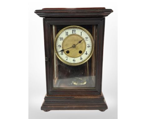An eight day mantel clock with enamel dial, height 30 cm