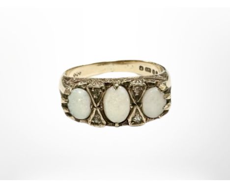 A 9ct gold opal and diamond ring, size M.  CONDITION REPORT: 3.8g 