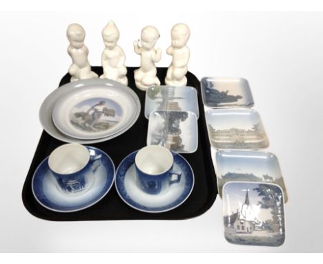 A group of four Danish porcelain figures of babies, Royal Copenhagen tea cups and saucers, shallow dishes 