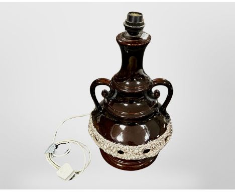 A glazed earthenware twin handled lamp base, height 48 cm  