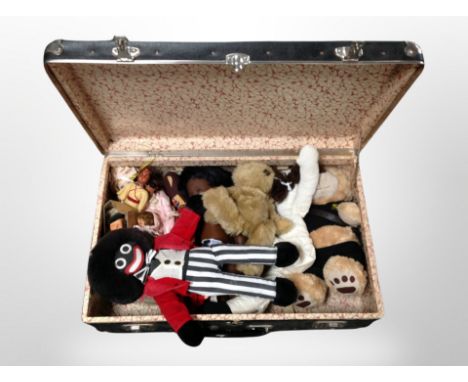 A vintage suitcase of soft toys, Golly doll, teddies etc 