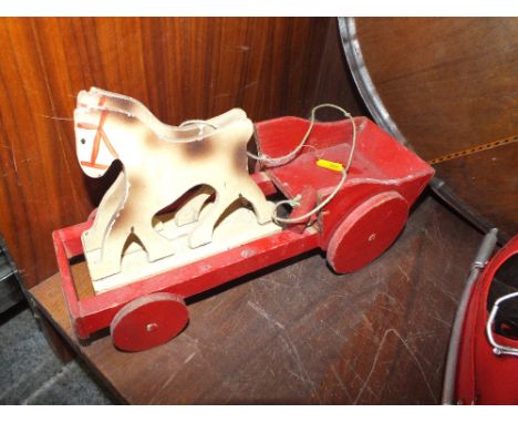 A VINTAGE WOODEN PULL ALONG HORSE AND CART TOY 