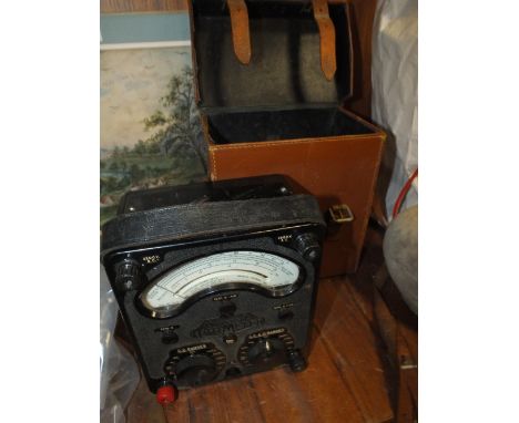 A VINTAGE LEATHER CASED UNIVERSAL AVOMETER 
