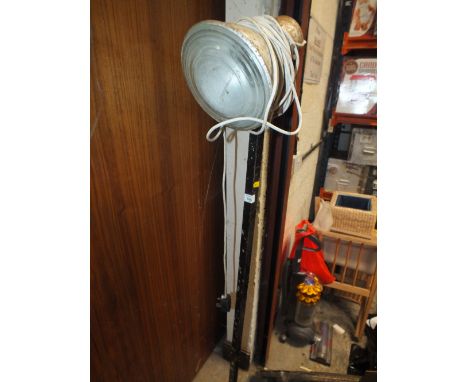 AN INDUSTRIAL STANDING LAMP