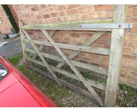 A WOODEN FIVE BAR GATE
