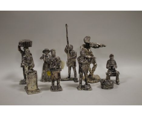 A COLLECTION OF CONTINENTAL WHITE METAL FIGURES (8)
