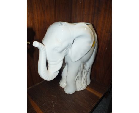 A CERAMIC ELEPHANT SHAPED STICK STAND 