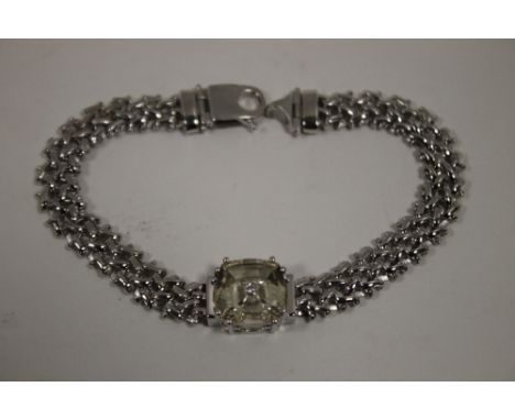 A SERENITE AND DIAMOND SILVER BRACELET, having a cushion cut serenite is 4.33 carats, measures approx 12 mm by 12 mm with app