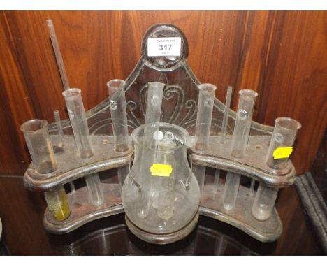 A VINTAGE CARVED OAK SCIENTIFIC TEST TUBE RACK 