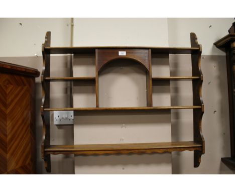 AN OAK OPEN HANGING SHELF