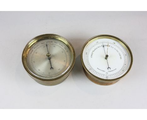 Two brass cased porthole barometers, one aneroid with silverised dial, the other holosteric with white enamel dial, both 12cm