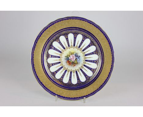 An Aynsley porcelain cabinet plate, the central floral motif signed J A (Joe) Bailey (dated 1937-1974) surrounded by blue int