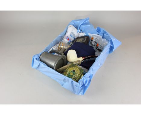 A box of Sir Patrick Moore memorabilia, to include a Hawaiian shirt, pewter mug, purse, pipe, tie, paperweight, letter opener