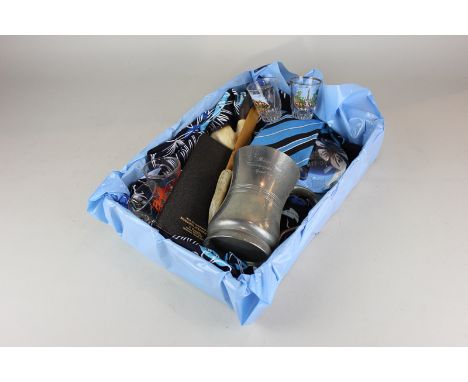 A box of Sir Patrick Moore memorabilia, to include a Hawaiian shirt, pewter mug, purse, pipe, tie, paperweight, letter opener