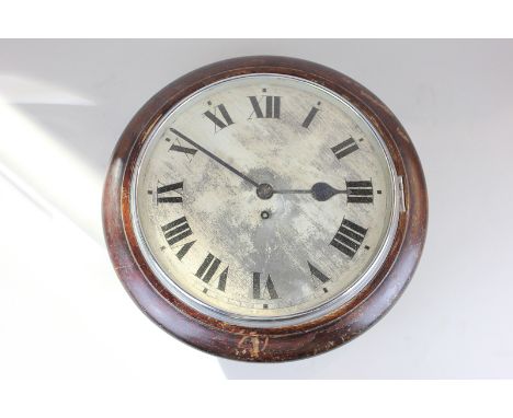 An eight day wall dial in mahogany case, cream enamel dial with Roman numerals (30cm diameter)