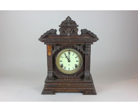 An American summit  strike 13 hour clock in carved mahogany case with brass bevel over circular white enamel dial with Roman 