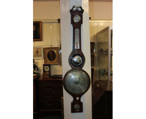 A Willman Bangor wheel barometer with spirit level, thermometer and humidity dial, 95cm