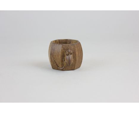 A Robert Mouseman Thompson oak napkin ring with eight curved sides, 4cm high