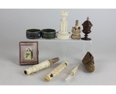 An ivory game token case in the shape of a turret, a pair of cloisonne napkin rings, an ivory thermometer holder and other pi