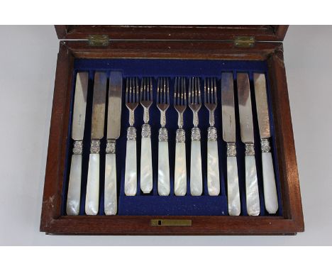 A Victorian mother of pearl handled silver dessert knife and fork set, Sheffield 1870, in mahogany fitted case