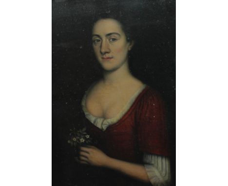 Circle of Nicolas de Largilliere portrait of a lady, half length, wearing a red bodice and holding a posy of flowers, oil on 