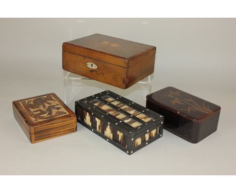 An ebony and porcupine quill trinket box and three others