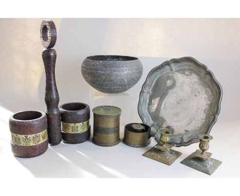 A brass ordnance shell pot and cover, a chamber stick, two other shell pots, an Indian brass bowl, a pair of dwarf candlestic