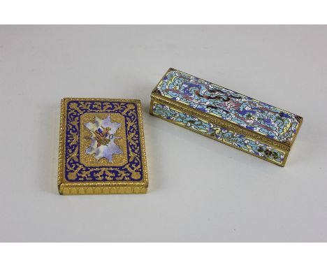 Two enamel and gilt boxes, one decorated with cherubs with a rich blue border, the other in bright enamelled floral patterns