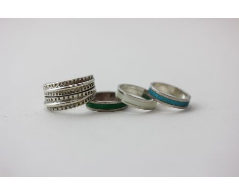 David Andersen a silver and green enamel ring; a silver and turquoise enamel ring; a white enamel ring and a silver ring