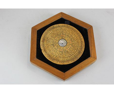 A Chinese circular wooden compass 14cm, in fitted hexagonal case, 23cm, (SPM)