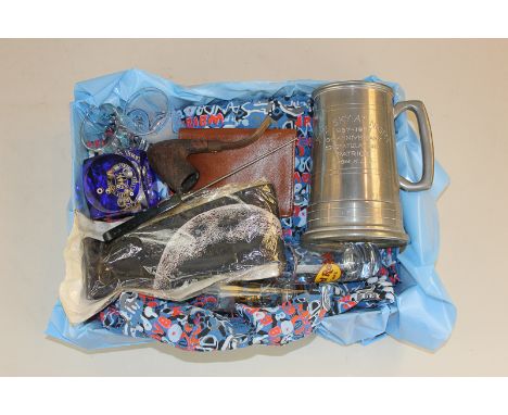 A box of Sir Patrick Moore memorabilia, to include a Hawaiian shirt, pewter mug, purse, pipe, tie, paperweight, letter opener