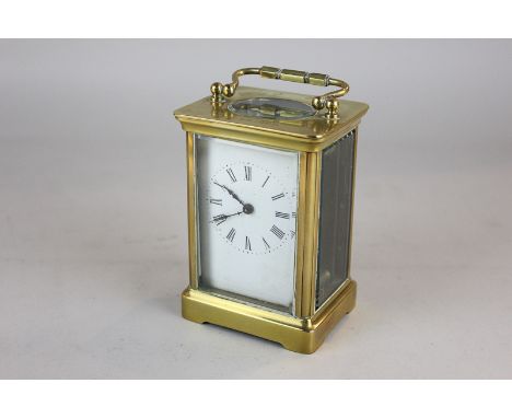 A brass and bevelled glass cased carriage clock (af) 14.5cm