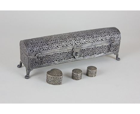 An Indian silverised filigree metal casket together with three Indian silver coloured metal trinket and pill boxes