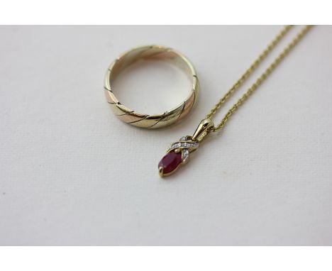 A 9ct three colour gold ring, 2.9g; a small ruby and diamond pendant on a gilt metal chain