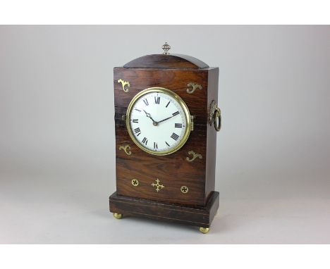A French eight day movement mantel clock in Regency rosewood case with inlaid brass decoration, a circular white enamel dial 