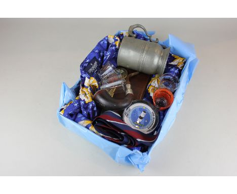 A box of Sir Patrick Moore memorabilia, to include a Hawaiian shirt, pewter mug, purse, pipe, tie, paperweight, letter opener