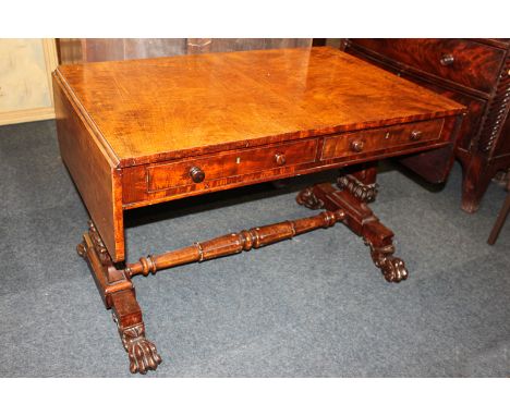 A George III walnut sofa table with one short and one dummy drawer to each side, on tapered legs with a turned stretcher, on 