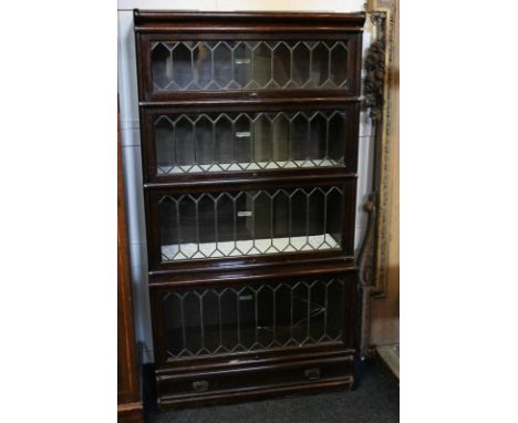 A Globe Wernicke four-tier oak bookcase with lead glazed doors, (SPM), 87cm