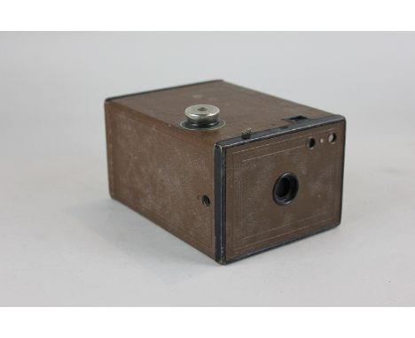 A Kodak Box Brownie camera, (SPM)