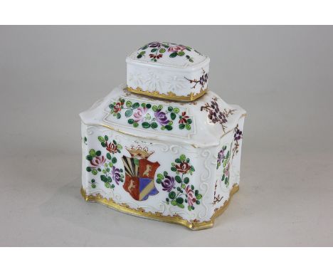 A Chinese porcelain tea caddy with armorial crest and hand painted floral decoration and gilt embellishment, 12cm high